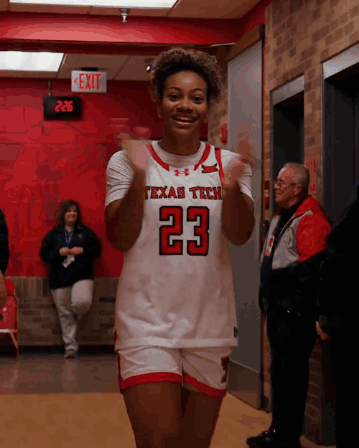 Woman in Texas Tech Jersey Clapping
