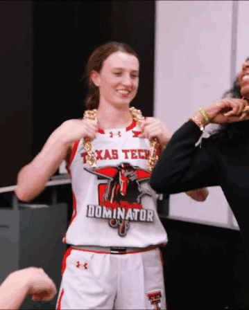 Woman in Texas Tech Jersey Holding Chain