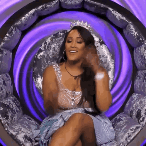 Woman in Tiara Sitting in Purple Chair