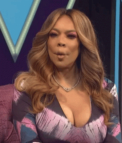 Woman In Tie Dye Dress Making Face GIF