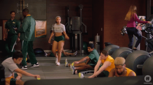 Woman in Titans Shirt in Gym