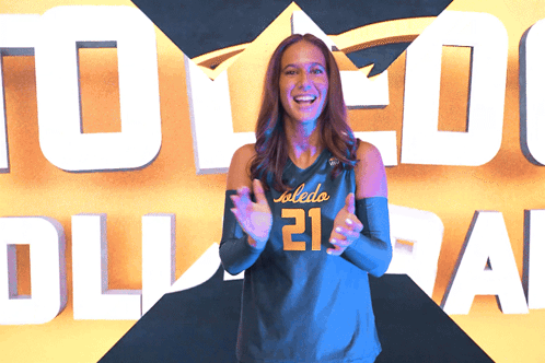 Woman in Toledo Jersey Applauds