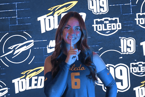 Woman in Toledo Jersey Holding Finger to Mouth