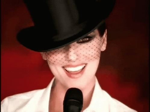 Woman in Top Hat and Veil Smiling
