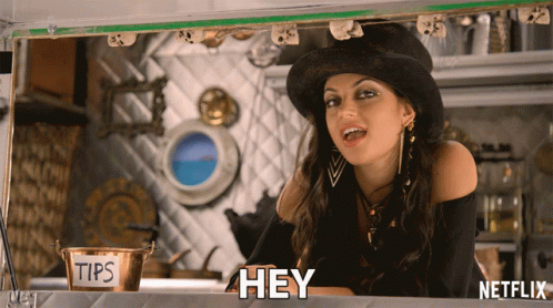 Woman in Top Hat Says Hey in Front of Tips Sign