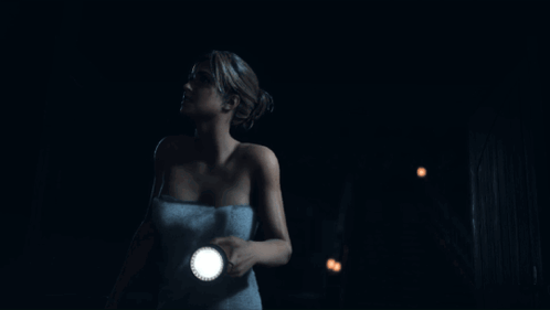 Woman In Towel Holding Flashlight In Dark GIF