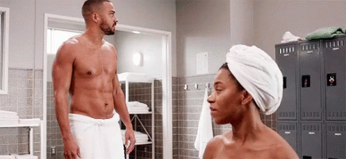 Woman In Towel With Man In Bathroom GIF