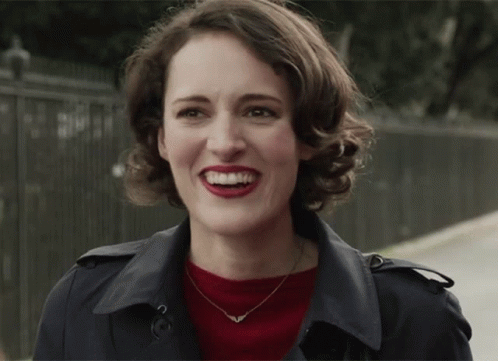Woman in Trench Coat and Red Lipstick Smiling