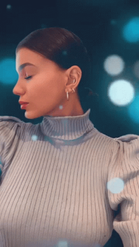 Woman in Turtleneck and Hoop Earrings Looking Down