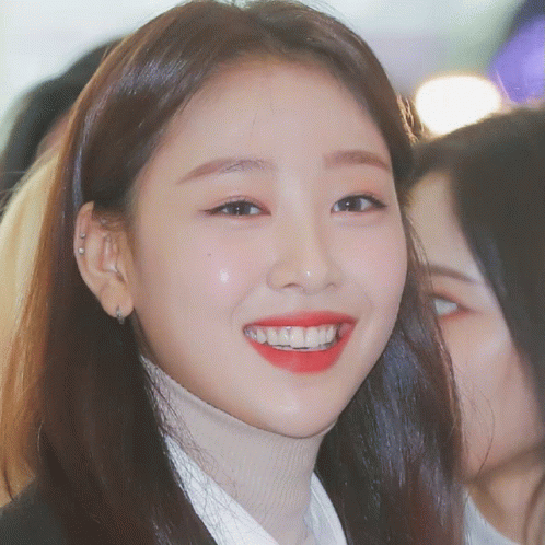 Woman In Turtleneck And Red Lipstick Smiling GIF