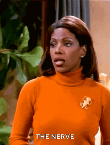 Woman in Turtleneck Saying The Nerve