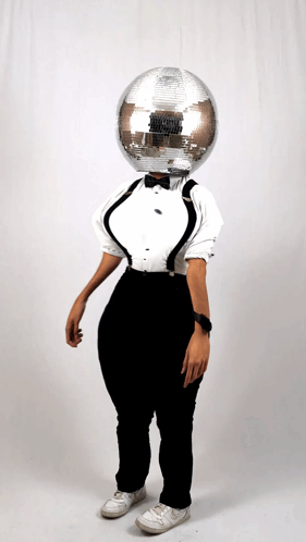 Woman in Tuxedo and Suspenders With Disco Ball on Head