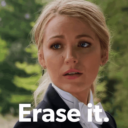 Woman In Tuxedo Saying Erase It GIF