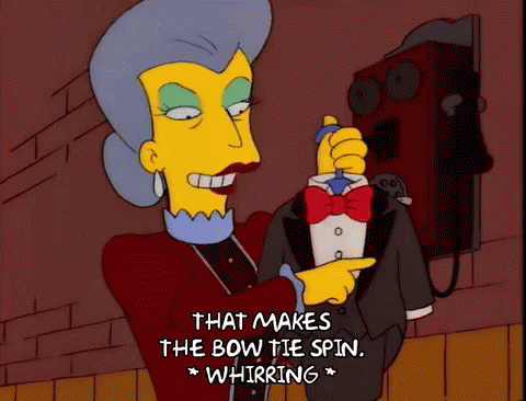 Woman in Tuxedo Says That Makes the Bow Tie Spin