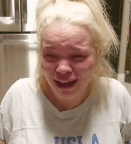 Woman in UCLA T-Shirt Crying