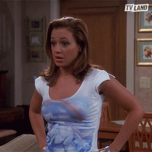 Woman in Unicorn T-Shirt in Front of TV Land Sign
