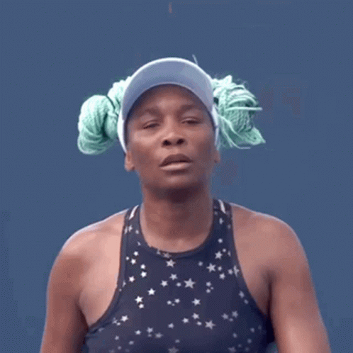 Woman In Visor And Star Tank Top With Rope In Hair GIF