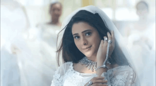 Woman in Wedding Dress and Veil Smiling