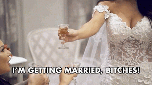 Woman in Wedding Dress Holding Champagne Says I'm Getting Married Bitches