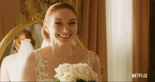 Woman In Wedding Dress Smiling Holding Bouquet Netflix Logo GIF