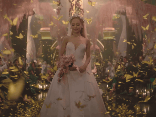 Woman In Wedding Dress Surrounded By Butterflies And Flowers GIF