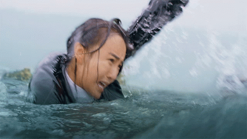 Woman in Wet Suit Pulled Out of Water