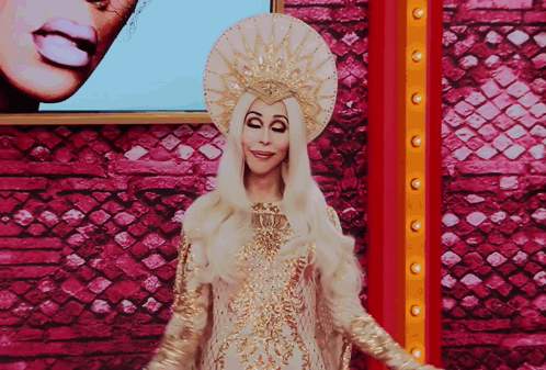Woman in White and Gold Costume Pink Wall