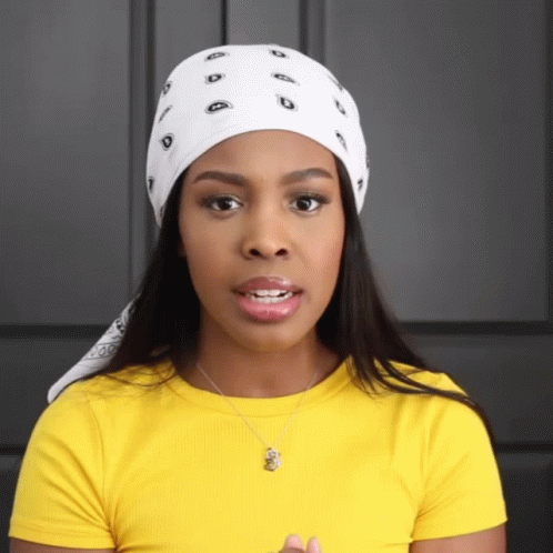 Woman in White Bandana and Yellow Shirt