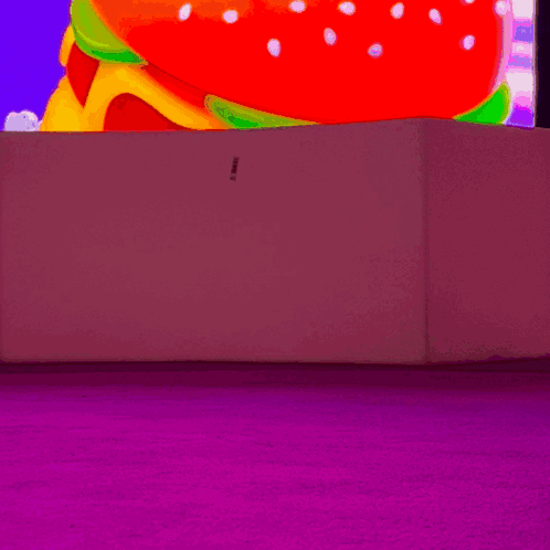 Woman In White Boots In Front Of Colorful Screen GIF