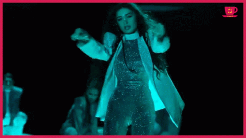 Woman in White Coat in Dark Room