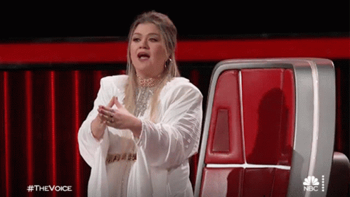 Woman in White Coat on The Voice