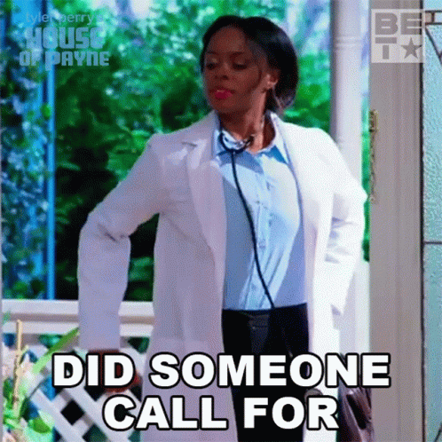 Woman in White Coat with Stethoscope