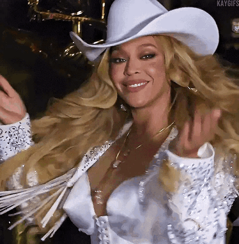 Woman in White Cowboy Hat and White Jacket