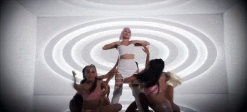 Woman in White Crop Top Surrounded by Women
