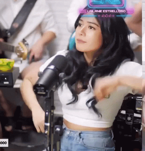 Woman in White Crop Top With Lailiane Estrella Sign