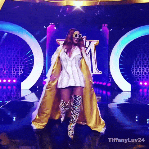 Woman in White Dress and Gold Cape On Stage With Tiffanyluv24