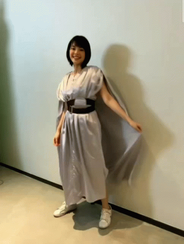 Woman in White Dress and Sneakers