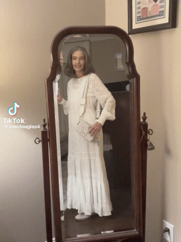 Woman In White Dress At Mirror With TikTok GIF