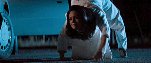 Woman In White Dress Crawling In Front Of Car GIF