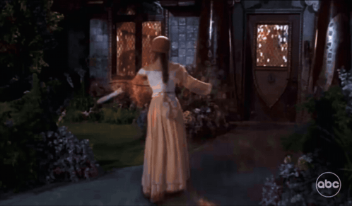 Woman In White Dress Dancing By House ABC GIF