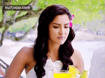 Woman in White Dress Holding Drink