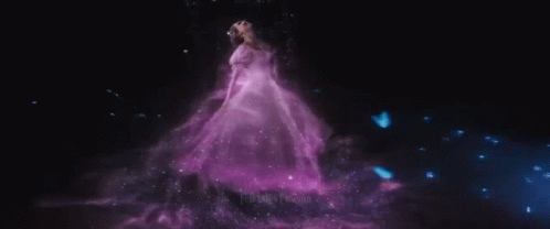 Woman In White Dress Holding Wand In Rain GIF