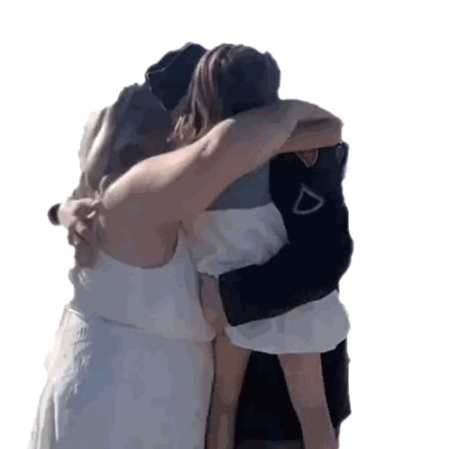 Woman in White Dress Hugging Woman and Child