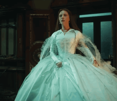 Woman in White Dress in Front of Mirror