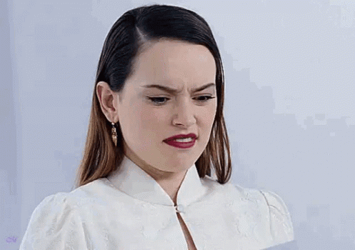 Woman In White Dress Making Funny Face GIF
