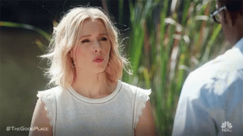 Woman In White Dress Next To Man In Blue Shirt GIF
