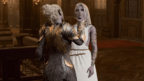Woman in White Dress Next to Woman in Gold Armor