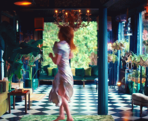 Woman in White Dress on Checkered Floor