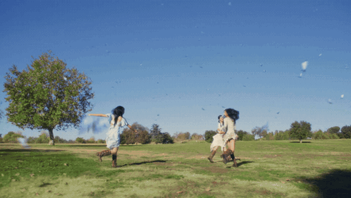 Woman In White Dress Running In Field GIF