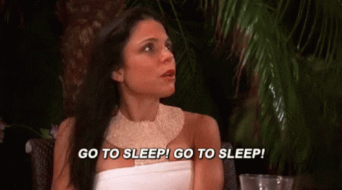 Woman in White Dress Saying Go to Sleep
